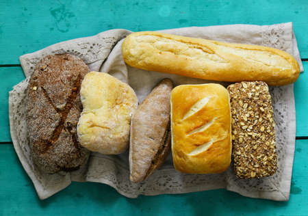 natural organic bread assortment on a wooden backgroundの写真素材