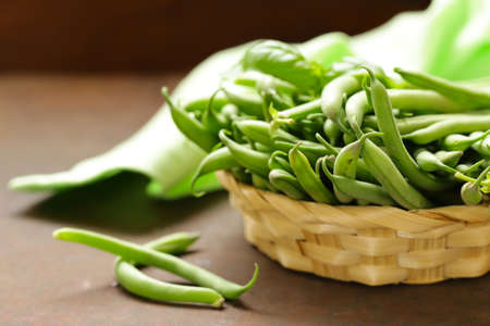 fresh organic pods green peas on a wooden tableの写真素材