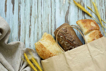 Fresh baguettes on a wooden table