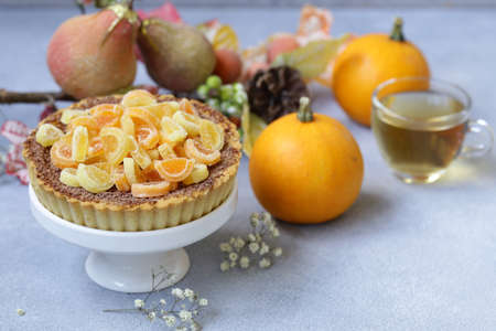 autumn tart pie with chocolate and berries