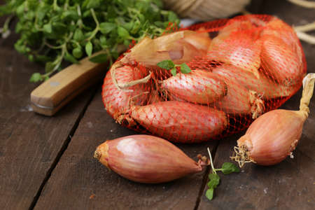 organic shallots on a wooden table, rustic style