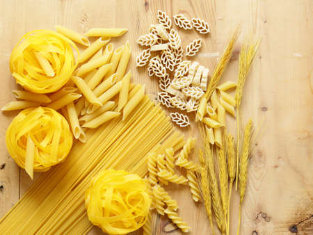 Pasta on wooden background, healthy foodの写真素材