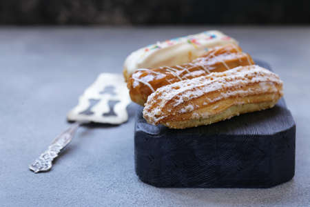 choux pastry eclairs with icing sugar