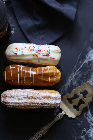 choux pastry eclairs with icing sugar