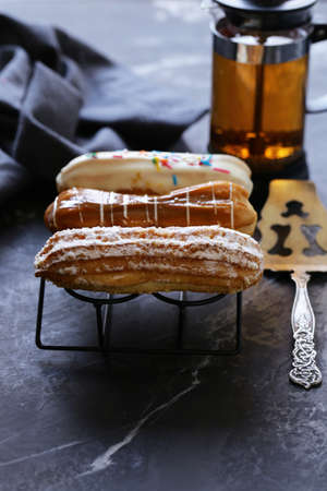 choux pastry eclairs with icing sugar