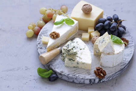 cheese board soft cheese, nuts and grapes