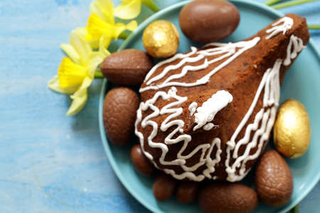 festive baking cake decorated eggs for Easterの写真素材
