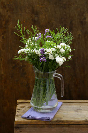 autumn flowers still life on a wooden backgroundの写真素材