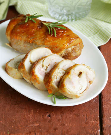 Baked chicken roulade with garlic and rosemaryの写真素材