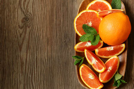 ripe organic red orange on wooden backgroundの写真素材