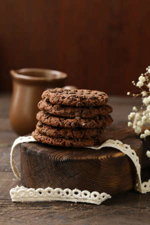 stack of chocolate chip cookies on a wooden table