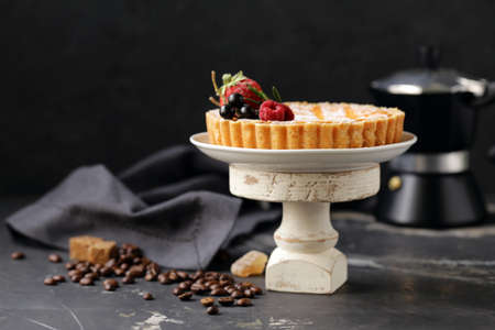 cheesecake with powdered sugar and berries