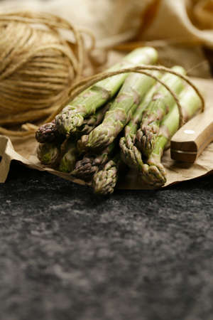 fresh organic green asparagus on the tableの写真素材