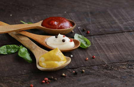 three variants of ketchup, mustard and mayonnaise sauceの写真素材