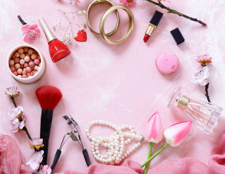 pink background with cosmetics and jewelry for womenの写真素材