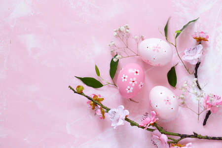decorated eggs for Easter on a pink background