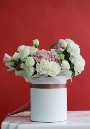 delightful bouquet of white and pink colors in a gift box