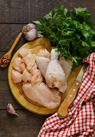 raw chicken meat on a cutting boardの写真素材