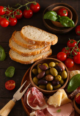 Italian food, prosciutto, olives, cheese and tomatoesの写真素材