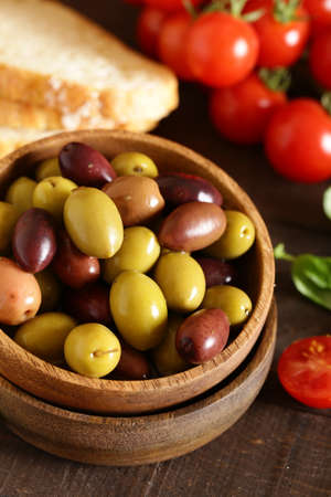 Kalamata red and green olives with herbs and herbsの写真素材