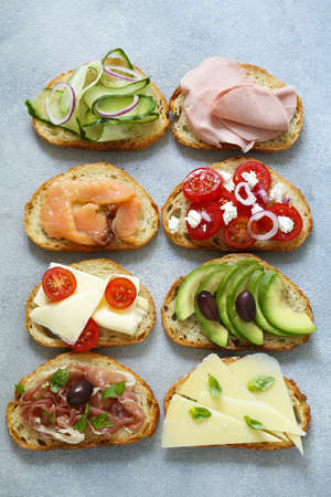 various sandwiches with vegetables and meat
