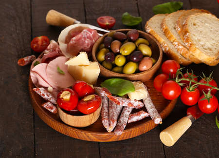 Italian food, prosciutto, olives, cheese and tomatoesの写真素材