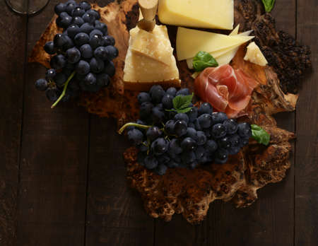cheeseboard on a wooden table, rustic style