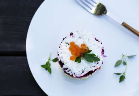 layered salad with beets, fish and potatoes