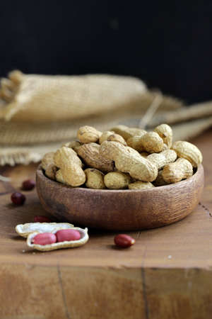 natural organic peanuts on a wooden table