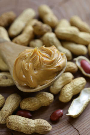 natural organic peanut butter on a wooden table