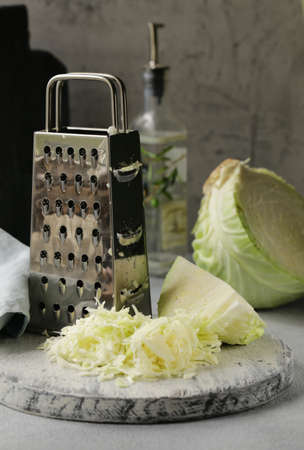 sliced cabbage for salad on a wooden boardの写真素材