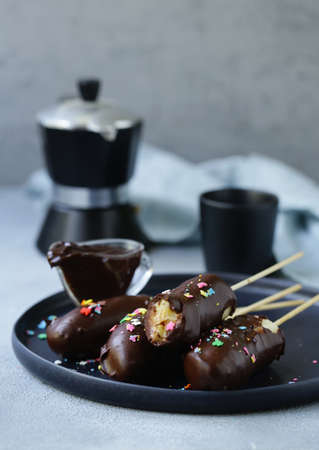 iced chocolate banana on a plateの写真素材