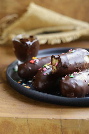 iced chocolate banana on a plateの写真素材