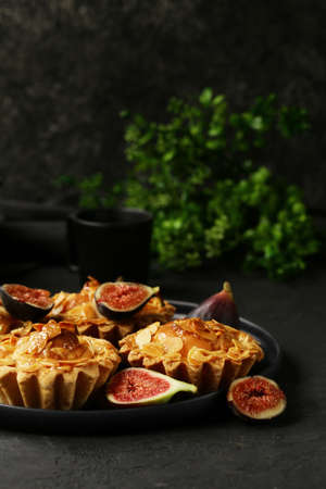 shortcrust tartlets with almonds and berriesの写真素材