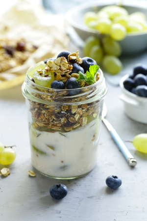homemade granola with yogurt and fruit, healthy breakfast