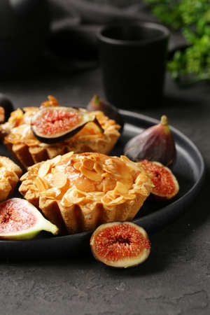 shortcrust tartlets with almonds and berriesの写真素材