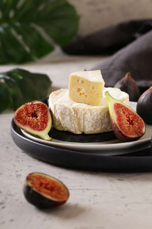 Camembert cheese with fresh figs for appetizersの写真素材