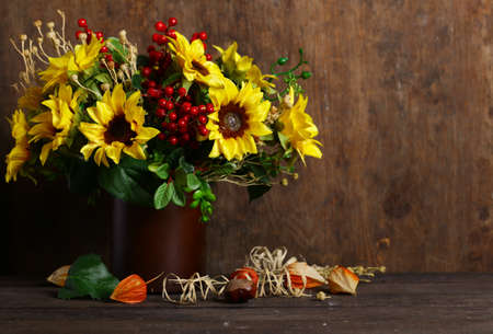 autumn bouquet of flowers with sunflowersの写真素材