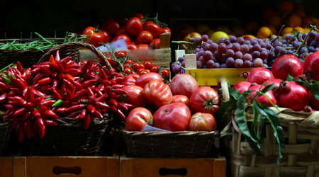 Italian vegetable market with tomatoes and zucchiniの写真素材
