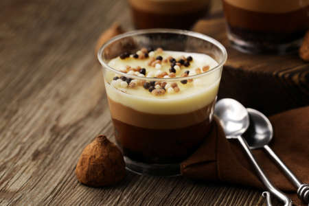 chocolate dessert in a glass on a tableの写真素材