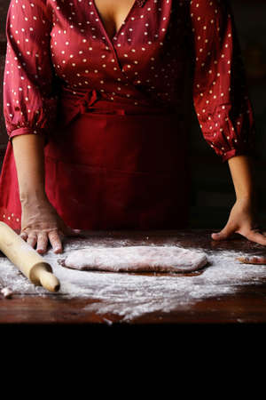 female with dough make homemade pasta