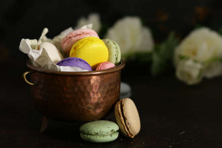 macaroons in a copper cup on the table