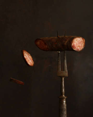 smoked meat sausage with spices and pepperの写真素材