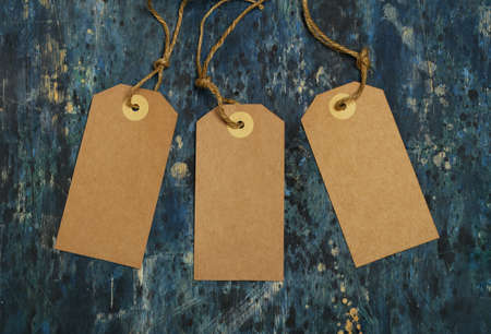 wooden background with cardboard label stickersの写真素材