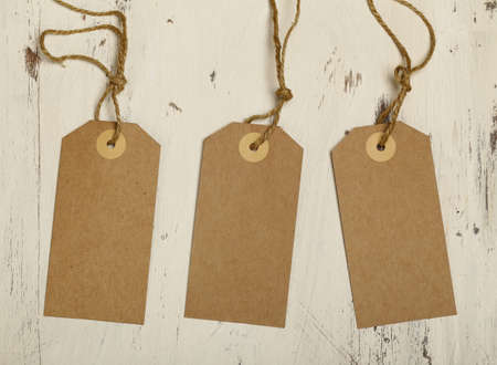 wooden background with cardboard label stickersの写真素材