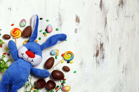chocolate eggs for easter decoration on wooden background