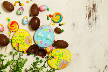 chocolate eggs for easter decoration on wooden background