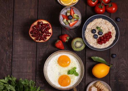 breakfast assortment porridge, fried eggs, chia puddingの写真素材