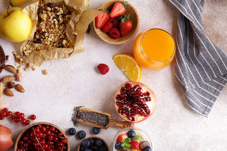 set healthy breakfast with berries, fruits, chia pudding and granola