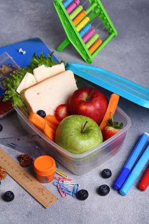 school lunch box with apple and sandwichの写真素材